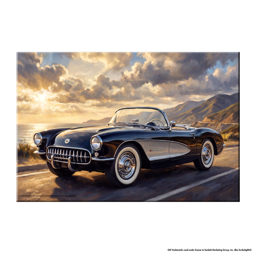 Black Chevrolet Corvette C1 open-top roadster canvas wall art displayed in home office on white wall above wooden desk at golden hour Pacific Coast Highway